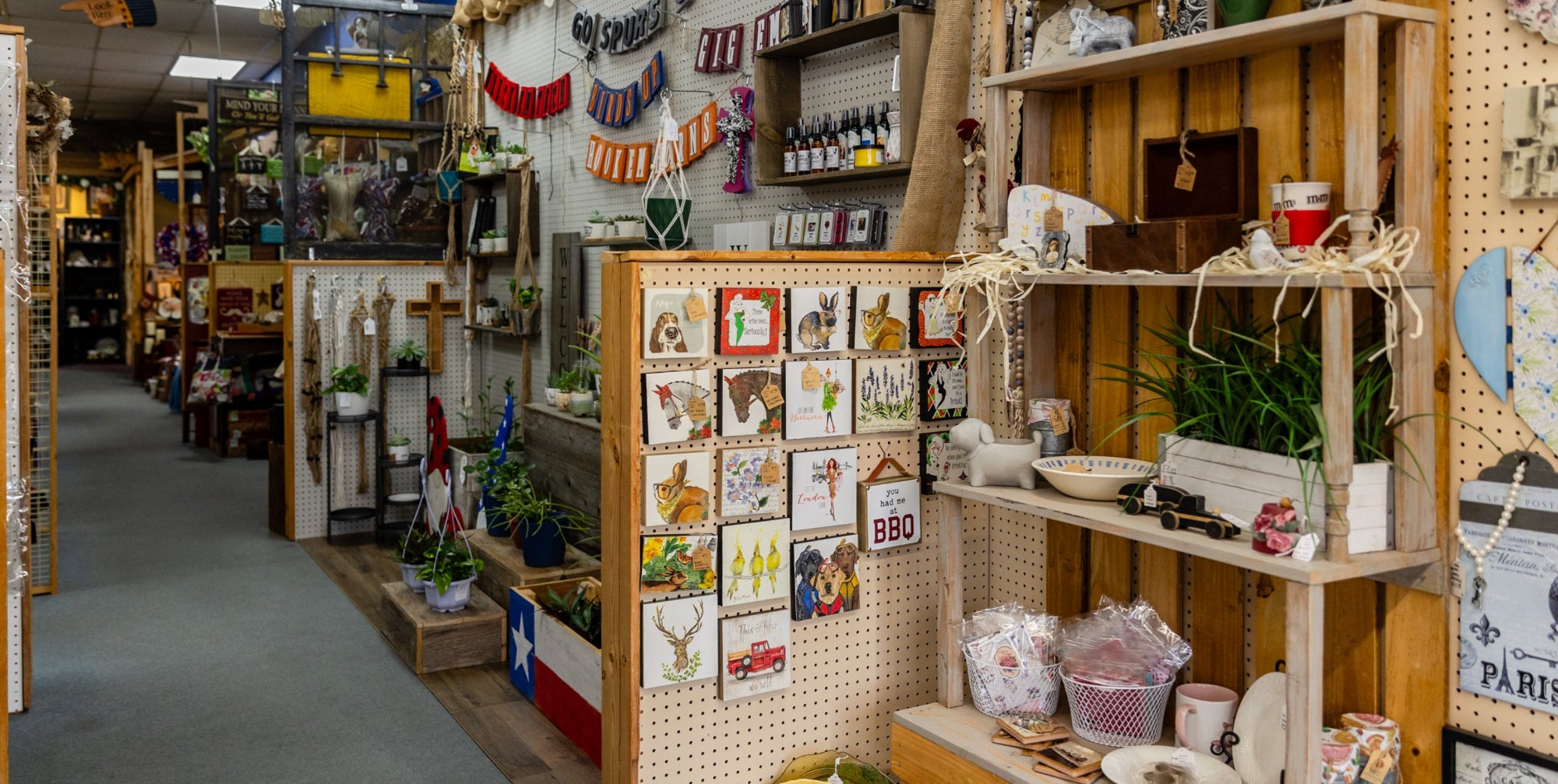 Alamo Craft Company interior with wooden shelves and decor items.