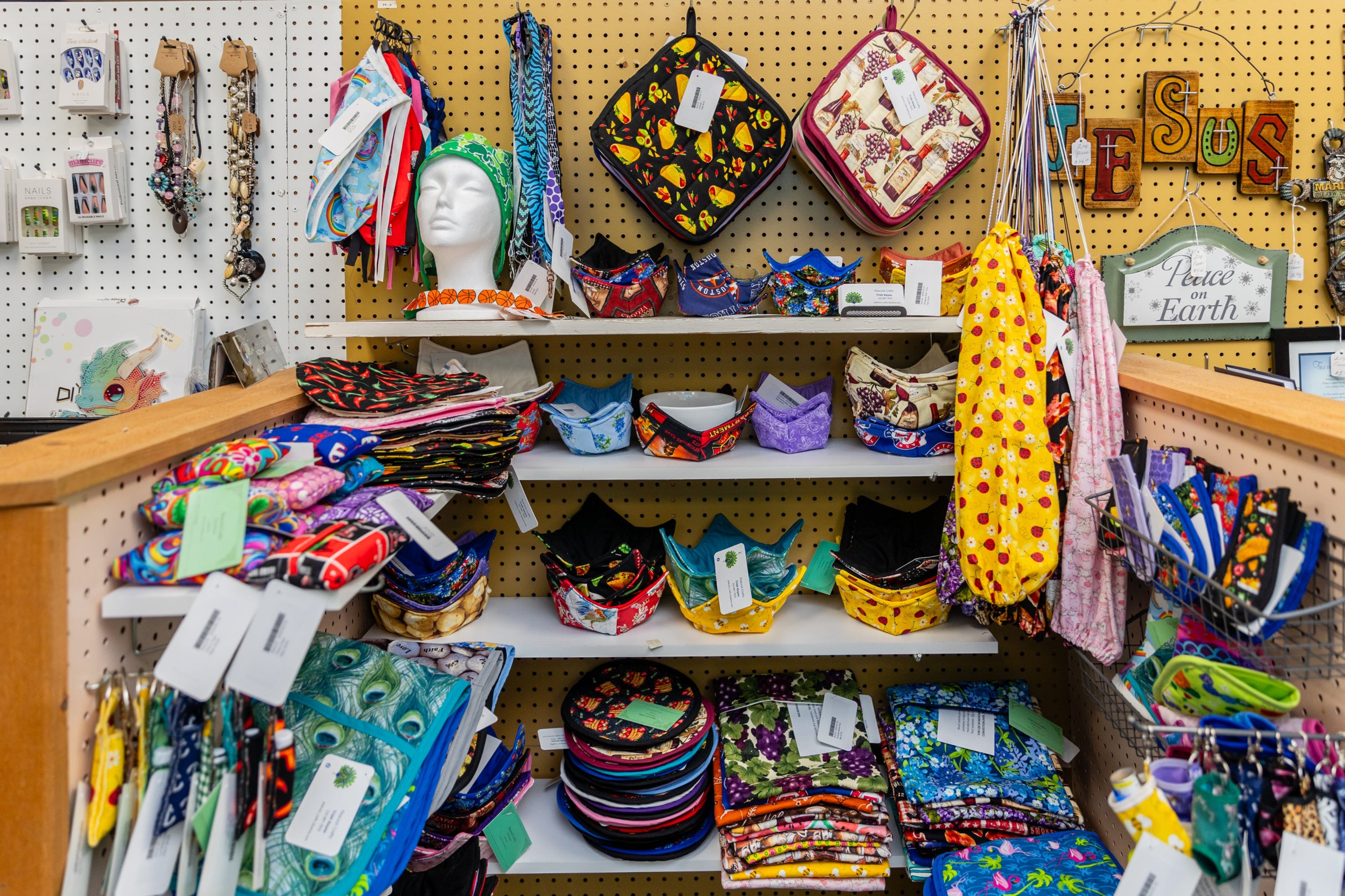 Display of colorful sewn kitchen accessories and more in a Booth at Alamo Craft Company San Antonio, TX