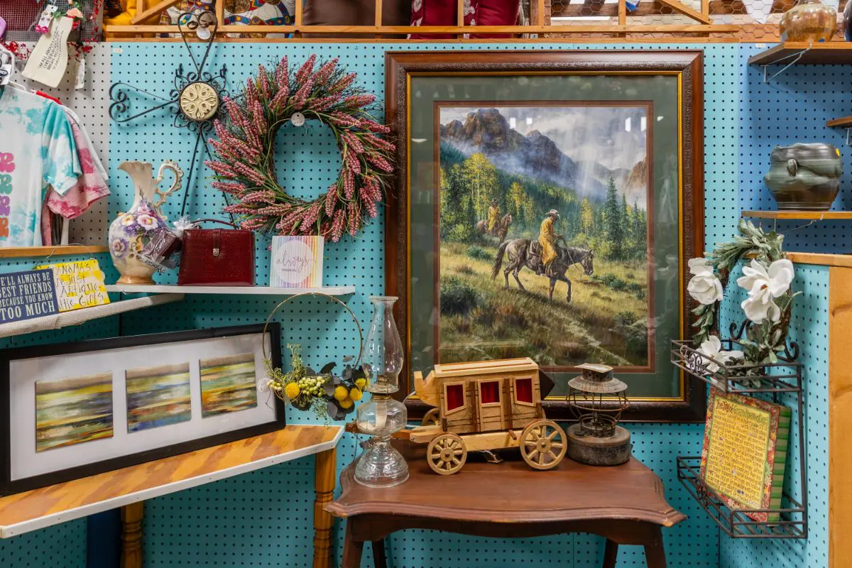 A table with a wagon and a painting on it