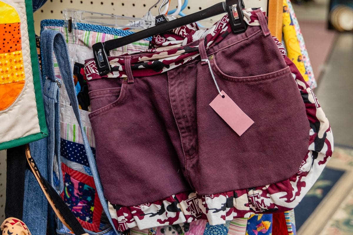 A pair of shorts with a tag hanging from the back.