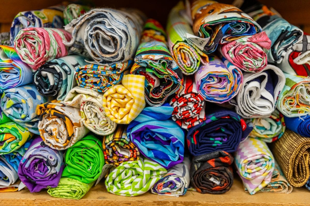 A pile of folded cloth in different colors.
