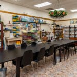 Craft store classroom with tables and chairs.